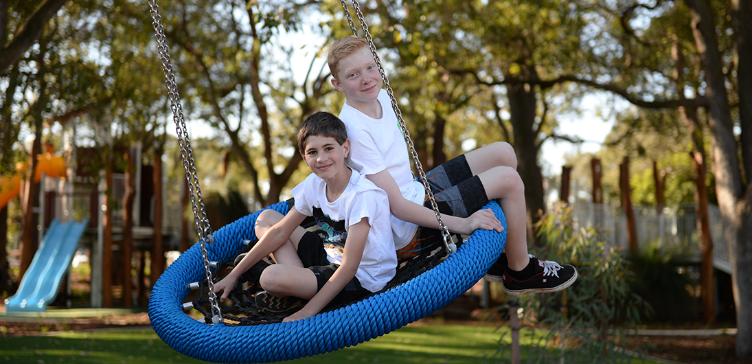 Children on a swing at the Kwinana Adventure Park