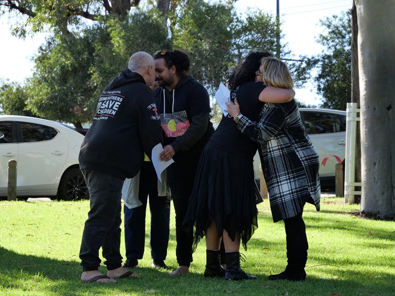 People embracing at the MACC Family Day