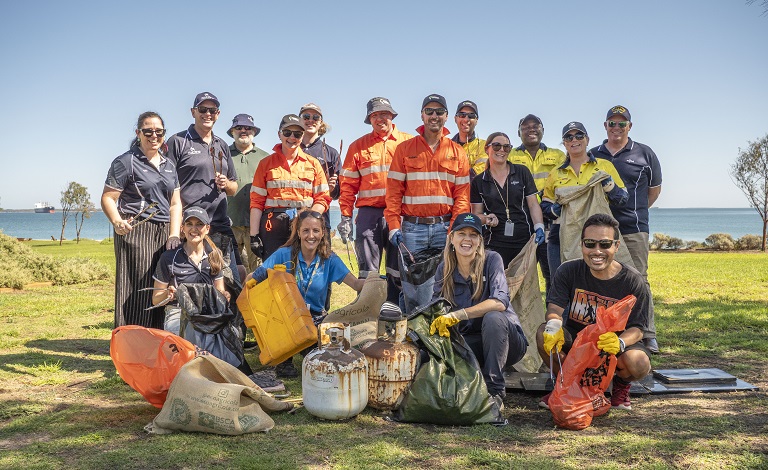 Businesses clean up the coastline at Kwinana Beach