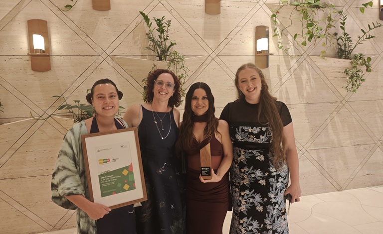 Four women of the winning circularity program holding a WasteSorted Award