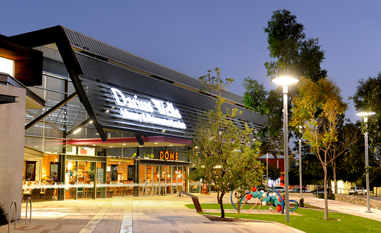 The exterior of the Darius Wells Library and Resource Centre at nighttime.