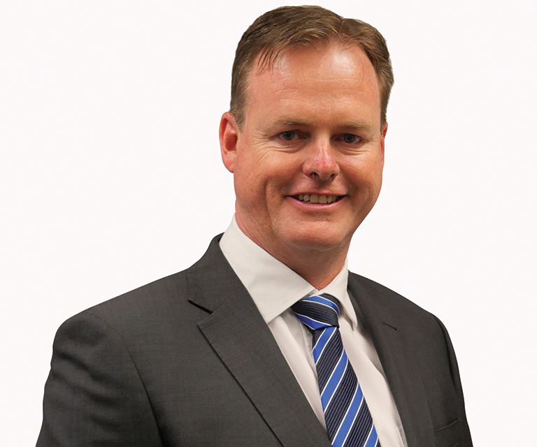 A headshot of City Life Director Garry Fisher.