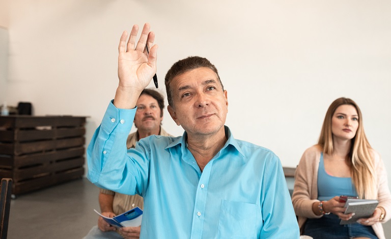A man raises his hand 