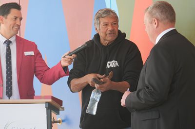 Elder Trevor Walley makes a presentation to Mayor Peter Feasey