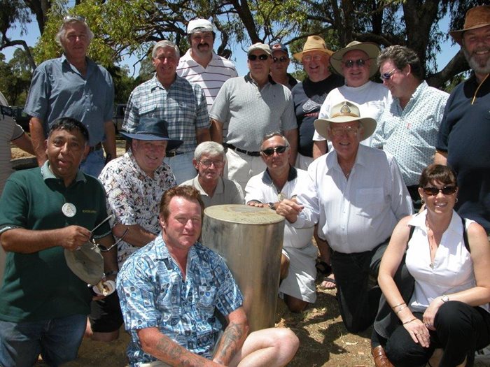 An image of the raising of the Apex Club time capsule in 2004.
