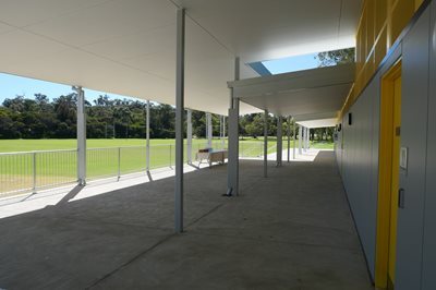Shaded spectators area overlooking the grass of Thomas Oval